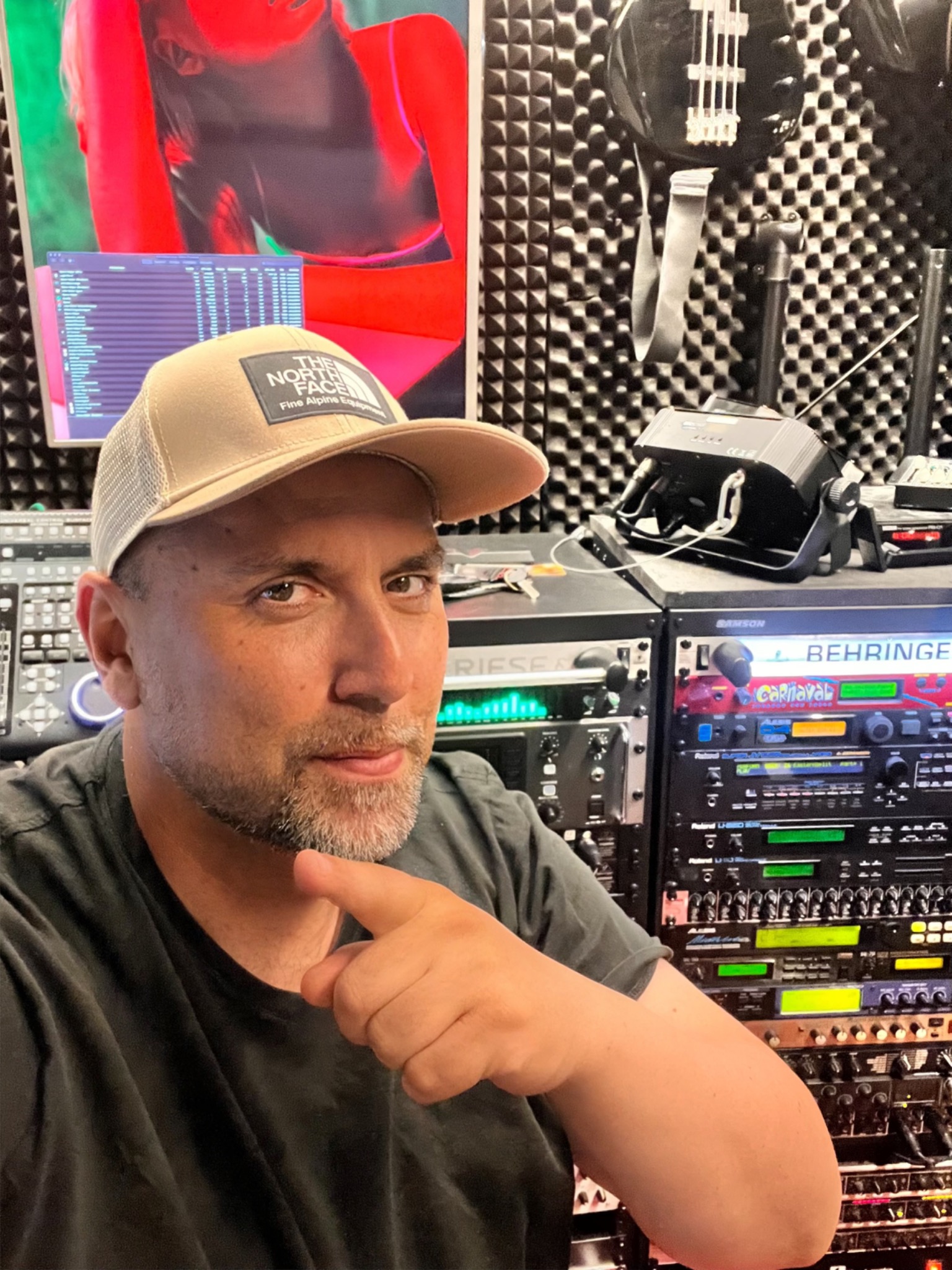 DJ Ufuk in his Airzwo studio surrounded by synthesizers, processors and studio equipment